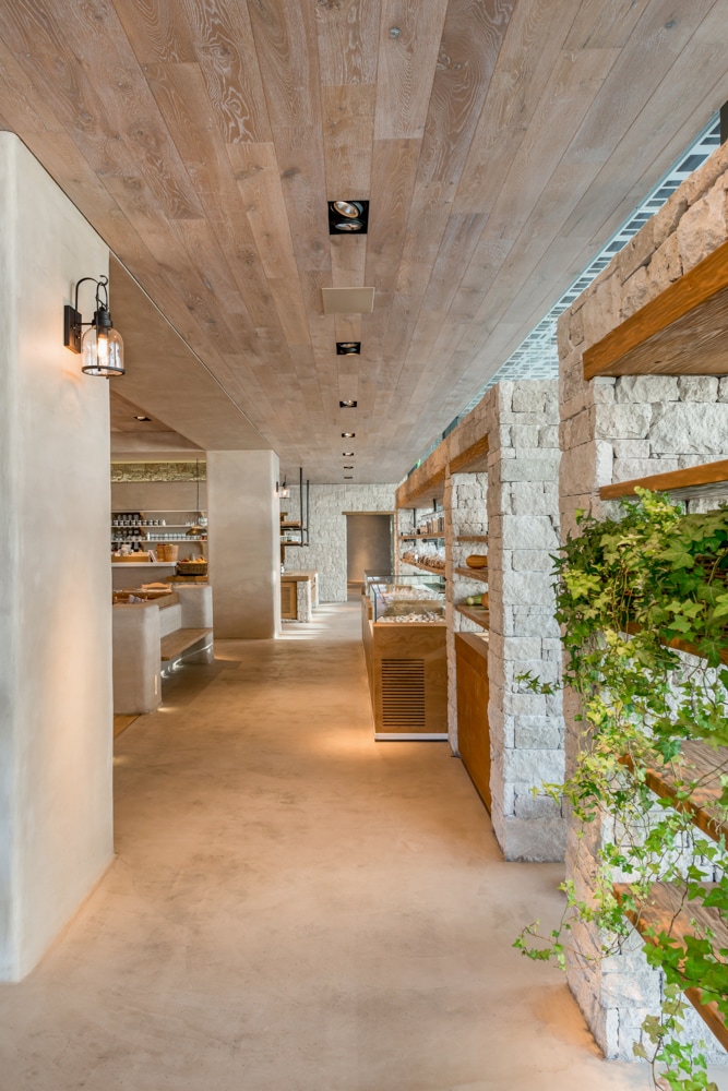 vegan raw restaurant#stone wall display#concrete floor#interior design#architexturestudio#architecture#interior design#roundcubephotography.jpg